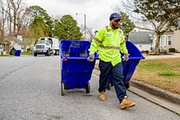 Worker taking the trash out, Greenville, date unknown. Original public domain image from Flickr