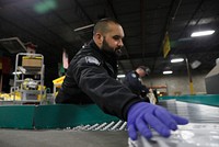 Officers with U.S. Customs and Border Protection, Office of Field Operations, screen packages for counterfeit products being shipped into the area as they participate in security operations leading up Super Bowl LII in Minneapolis, Minn., Jan. 29, 2018.