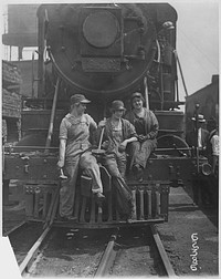 "Busch [Bush] Terminal. Women Laborers Seated on Front of Engine in Railroad Yard. War Industries Picture." Original public domain image from Flickr