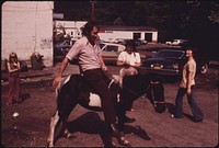 A Miner Who Had Completed His Work Shift Is Shown on a Pony Belonging to the Family of the Tavern Operator 06/1974. Photographer: Corn, Jack. Original public domain image from Flickr