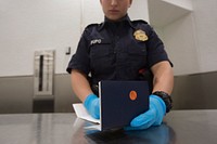 U.S. Customs and Border Protection, Office of Field Operations, officers conduct standard arrival screening operations at Miami International Airport in Miami, Florida, Jan. 10, 2018.