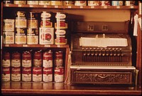 Old Style Cash Register and Canned Goods in a Butcher Shop in New Ulm, Minnesota.