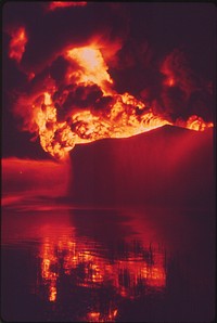 A Texaco Crude Oil Tank Blazes Against the Night after Being Struck by Lightning. Original public domain image from Flickr