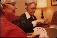 A Librarian, Left, and a Teacher, Both Employees of Senior High School in New Ulm, Minnesota, Are Seen Playing Bridge in the Evening.