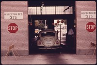 Car Has Just Entered the Safety Lane at an Auto Emission Inspection Station in Downtown Cincinnati, Ohio 09/1975. Photographer: Eiler, Lyntha Scott. Original public domain image from Flickr