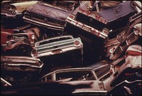 Stacked Autos Are Crushed and Shipped to Japan, Then Return to the United States as Toyotas and Datsuns to Begin the Cycle Once Again 02/1974. Photographer: Falconer, David. Original public domain image from Flickr