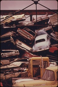 Stacked Autos Are Crushed and Shipped to Japan, Then Return to the United States as Toyotas and Datsuns to Begin the Cycle Once Again 02/1974. Photographer: Falconer, David. Original public domain image from Flickr