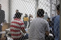 U.S. Border Patrol agents conduct intake of illegal border crossers at the Central Processing Center in McAllen, Texas, Sunday, June 17, 2018.