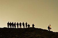 Afghan Border Policemen patrol a hill in the Wam Valley of the Kandahar province of Afghanistan Dec. 22, 2009, to secure the Afghan border from infiltration and illegal entry of persons and contraband.