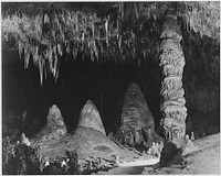 "Two people in background, 'The Rock of Ages in the Big Room,' Carlsbad Caverns National Park," New Mexico. Photographer: Adams, Ansel, 1902-1984. Original public domain image from Flickr