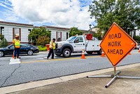 Traffic ServicesGreenville Public Works Traffic Services employees repair road markings on Evans Street in Uptown Greenville, October 2, 2018.