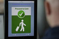 A VeriScan facial recognition tablet tells a passenger to proceed to the gate after taking a photo in the next phase of CBP's use of biometrics at Dulles International Airport in Dulles, Va., Sept. 6, 2018.