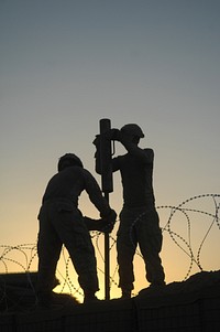 U.S. Soldiers from the 5th Stryker Brigade Combat Team, 2nd Infantry Division construct an Afghan Highway Police checkpoint in Robat, Afghanistan, March 19, 2010.