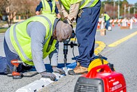 Traffic delineator installation at Charles Blvd and Smythewick Dr, part of the City's effort to improve traffic safety. November 21, 2018. Original public domain image from Flickr