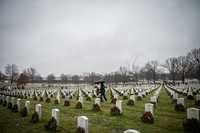 Volunteers lay wreaths in Section 64 during the 27th National Wreaths Across America Day at Arlington National Cemetery, Arlington, Virginia, Dec. 15, 2018.