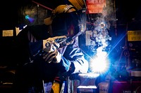 U.S. Navy Fireman Coltin Wells welds a pipe in the weld shop aboard the Wasp-class amphibious assault ship USS Kearsarge (LHD 3) in the Atlantic Ocean Dec. 24, 2018.