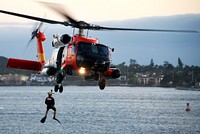 A U.S. Coast Guard Sector San Diego MH-60T Jayhawk helicopter crew conducts a search and rescue demonstration in San Diego, August 10, 2019.