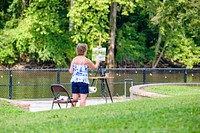 Woman painting in the park, Greenville, date unknown.  Original public domain image from Flickr