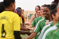 U.S. Air Force women deployed to Nigerien Air Base 201 and the Nassara Athletic Club Women’s Soccer Team shake hands after a community outreach game at the Agadez Sports Stadium in Agadez, Niger, July 5, 2019.