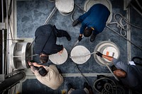 U.S. Navy Civil Service mariners assigned to the Spearhead-class expeditionary fast transport ship USNS Carson City (T-EPF 7) heave line as the ship arrives in Abidjan, Cote D'Ivoire, July 15, 2019.