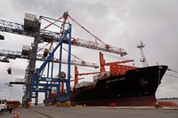 A cargo ship is offloaded by massive cranes at Penn Terminals in Eddystone, Pa., April 16, 2020.