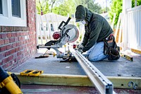 Finishing touches are applied to the exterior of a home undergoing rehabilitation through the City of Greenville's Housing Division programs. April 16, 2020. Original public domain image from Flickr