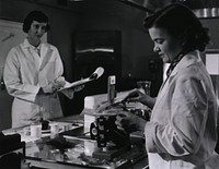 Two female dietitians weigh and measure foods before they are served to patients of restrictive diets. Original public domain image from Flickr