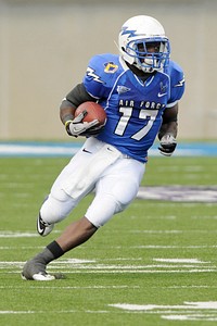 U.S. Air Force Academy Cadet Asher Clark runs the ball up the field during a football game between the academy and Colorado State University in Colorado Springs, Colo., Oct. 9, 2010.