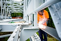 Work to upgrade and improve the Town Common Greenway Pedestrian Bridge continues, June 29, 2020. Original public domain image from Flickr