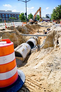 Construction crews prepare for paving along Reade Circle while drain pipe and junctions are installed along W 8th St, July 16, 2020. Original public domain image from Flickr