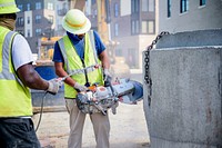 Construction crews prepare for paving along Reade Circle while drain pipe and junctions are installed along W 8th St, July 16, 2020. Original public domain image from Flickr