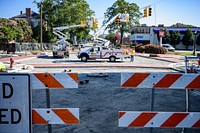 Temporary traffic and pedestrian signals are installed at Evans Street while trees are planted along Reade Circle, July 14, 2020. Original public domain image from Flickr