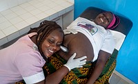 Midwife Amichia Solange (L) attends to Angelica Konate at Mouyassue Health Centre in Cote d'Ivoire on 3rd March 2020.