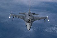 A U.S. Air Force F-16C Fighting Falcon with the 177th Fighter Wing flies behind a 108th Wing KC-135R Stratotanker during aerial refueling. Original public domain image from Flickr
