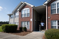 Hunters Ridge Apartments resident Shamar El-Shabazz expresses his happyness with living at the multifamily property development, in Farmville, NC, on Aug. 30, 2021. USDA Photo Media by Lance Cheung. Original public domain image from Flickr