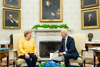 President Joe Biden meets privately with German Chancellor Angela Merkel on Thursday, July 15, 2021, in the Oval Office of the White House. (Official White House Photo by Adam Schultz). Original public domain image from Flickr