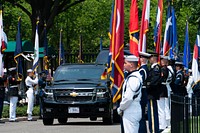 A motorcade, carrying German Chancellor Angela Merkel, drives through a color guard cordon Thursday, July 15, 2021, as they arrive to the West Wing Lobby Entrance of the White House. (Official White House Photo by Erin Scott). Original public domain image from Flickr