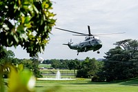 Marine One, carrying President Joe Bident, prepares to land on the South Lawn of the White House Lawn. Original public domain image from Flickr