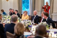 President Joe Biden and First Lady Jill Biden, joined by Vice President Kamala Harris, Second Gentleman Douglas Emhoff, and invited guests, host a dinner for German Chancellor Angela Merkel and her husband Professor Joachim Sauer on Thursday, July 15, 2021, in the State Dining Room of the White House. (Official White House Photo by Adam Schultz). Original public domain image from Flickr