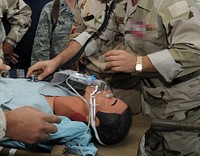 U.S. Air Force Lt. Col. Karen Wade, center, deputy chief nurse from the 332nd Expeditionary Medical Group, observes members of the Iraqi army participating in the In-Country Clinical Observership (ICCO) training program Oct. 26, 2010, at Joint Base Balad in Salahuddin province, Iraq. The ICCO included advanced medical care skills and administration for Iraqi army physicians and nurses.