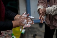 Washing hands, COVID-19 prevention. Original public domain image from Flickr