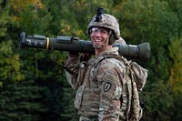 Army Sgt. 1st Class James Stineman, a paratrooper assigned to Dog Company, 3rd Battalion, 509th Parachute Infantry Regiment, 4th Infantry Brigade Combat Team (Airborne), 25th Infantry Division, U.S. Army Alaska, smiles after hitting his target with the M136E1 AT4-CS confined space light anti-armor weapon during live-fire training at Joint Base Elmendorf-Richardson, Alaska, September 15, 2021. (U.S. Air Force photo by Alejandro Peña). Original public domain image from Flickr