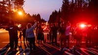 South Lake Tahoe locals cheer, yell and blow horns to thank the firefighters for their support in protecting their homes from the Caldor Fire. The locals gathered for several days near the Incident Command Post in South Lake Tahoe. Original public domain image from Flickr