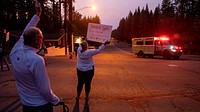 South Lake Tahoe locals cheer, yell and blow horns to thank the firefighters for their support in protecting their homes from the Caldor Fire. The locals gathered for several days near the Incident Command Post in South Lake Tahoe. Original public domain image from Flickr