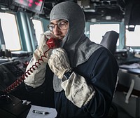 Ensign Nicholas Lumacuri, assigned to the Arleigh Burke-class guided-missile destroyer USS Porter (DDG 78) conduct General Quarters operations as part of Fleet Operational Sea Training (FOST) with the Royal Navy in Plymouth, United Kingdom, September 30, 2021. Original public domain image from Flickr