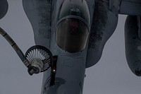 A U.S. Marine Corps F/A-18C Hornet with Marine Fighter Attack Squadron 115 "Silver Eagles" is refueled by a U.S. Air National Guard KC-135R Stratotanker with New Jersey’s 141st Air Refueling Squadron “Tigers” during exercise Scarlet Dragon. Original public domain image from Flickr