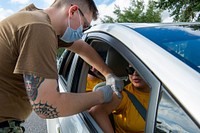 NMRTC Pensacola Drive-Thru Flu Vaccine Clinic in Florida, October 16, 2021. (U.S. Navy photo by Chief (Select) Mass Communication Specialist Brannon Deugan/Released). Original public domain image from Flickr