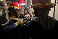 Sailors aboard the Arleigh Burke-class guided-missile destroyer USS Porter (DDG 78 respond to a casualty during a General Quarters drill in Atlantic Ocean, October 16, 2021.  (U.S. Navy photo by Mass Communication Specialist 2nd Class Katie Cox) Original public domain image from Flickr