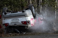 Damaged vehicle, rescue team. Original public domain image from Flickr