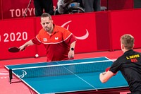 Athletes compete during a table tennis match at the Tokyo Paralympics, Wednesday Aug. 25, 2021, at the Tokyo Metropolitan Gymnasium in Tokyo, Japan. (Official White House Photo by Cameron Smith). Original public domain image from Flickr
